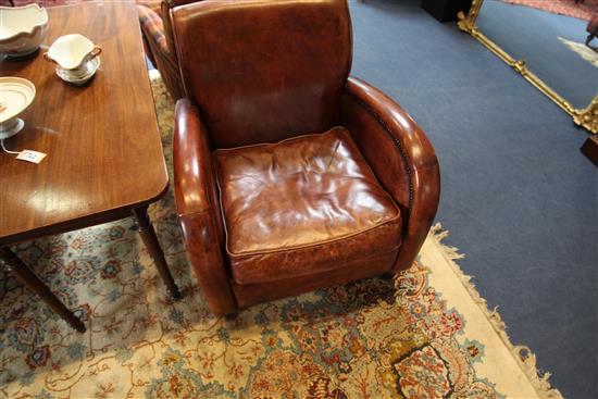 A pair of 1930s style brass studded leather club armchairs,